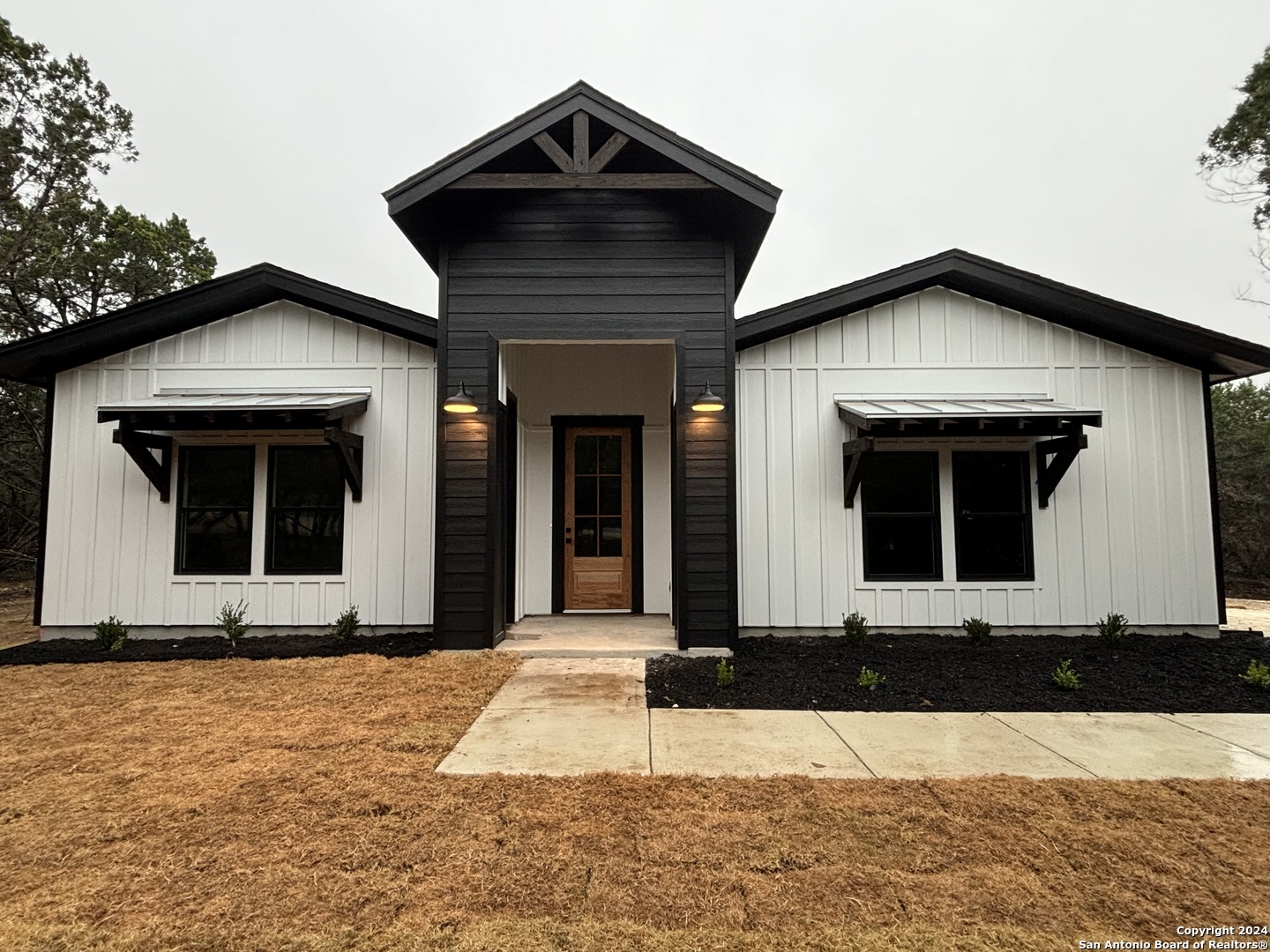 a front view of a house with yard