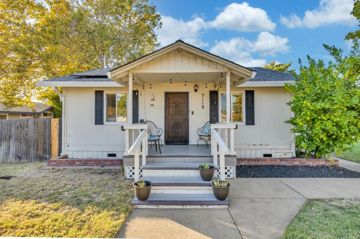 a front view of a house with stairs