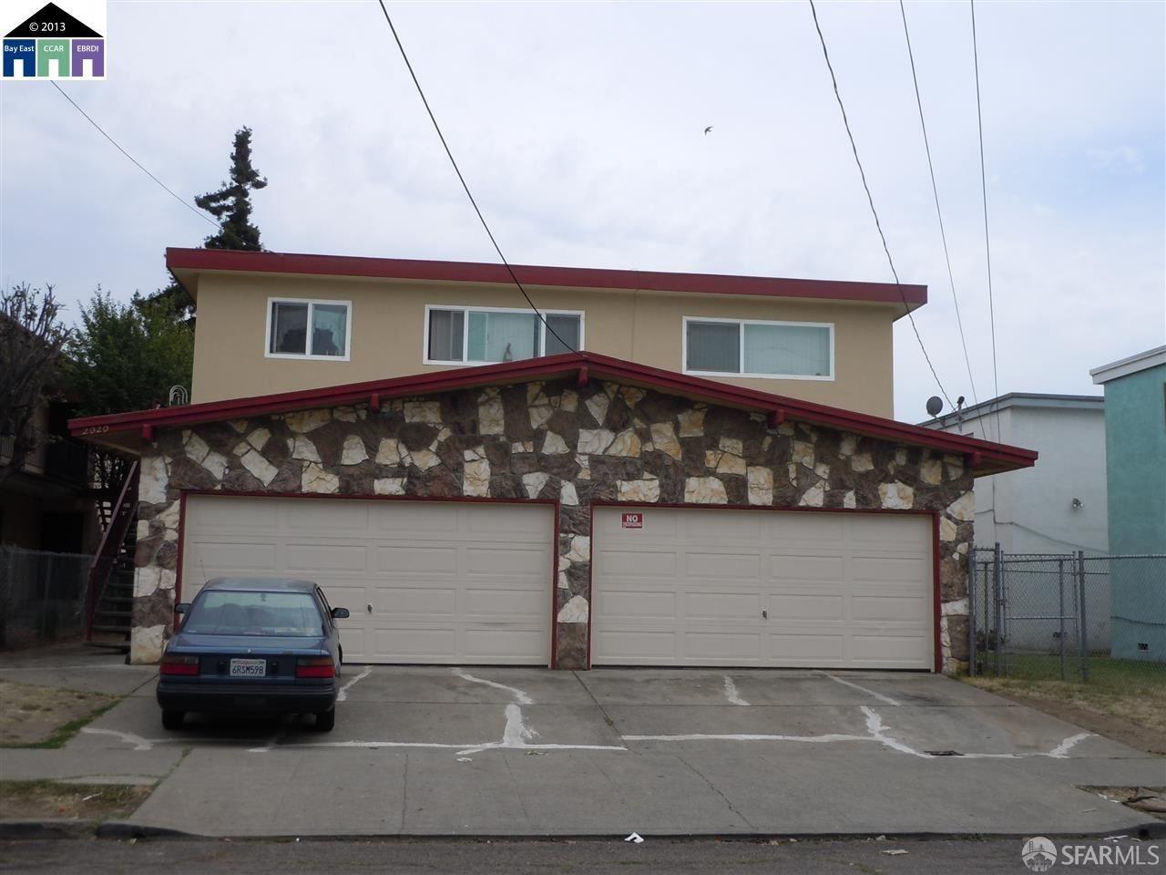 a front view of a house with parking