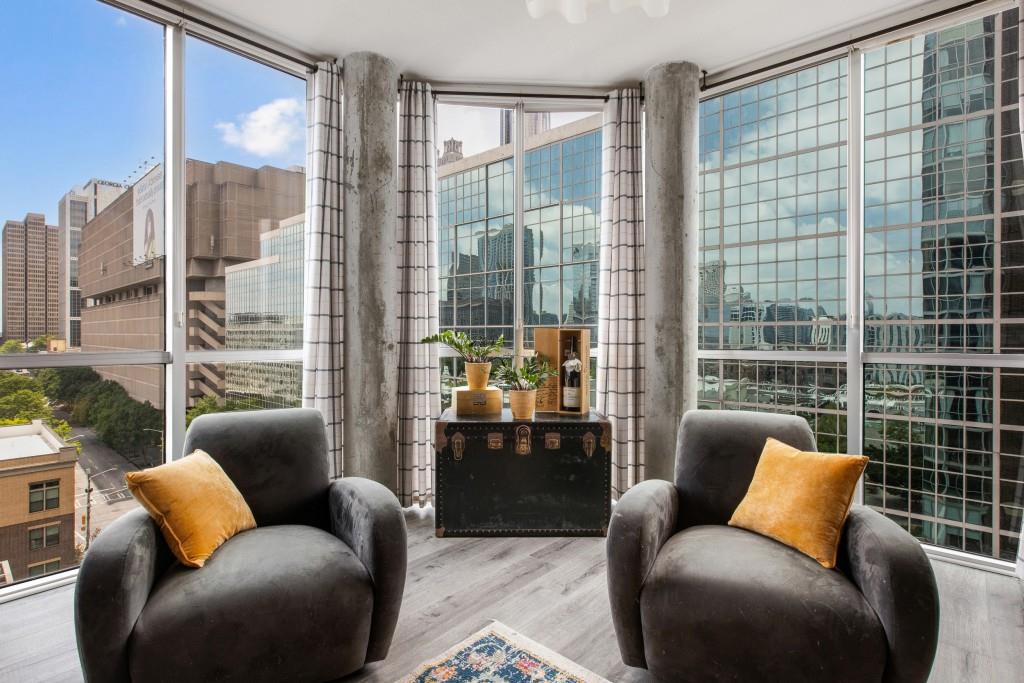 a blue couch sitting in front of a window