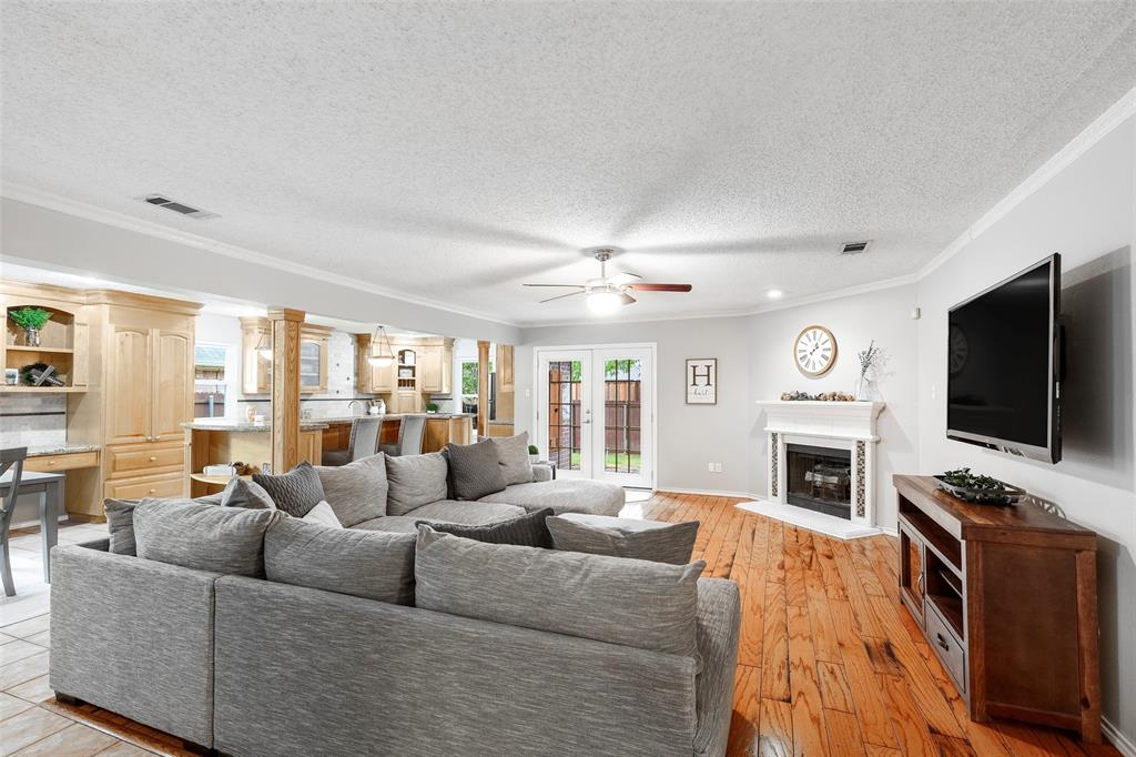 a living room with furniture flat screen tv and a fireplace