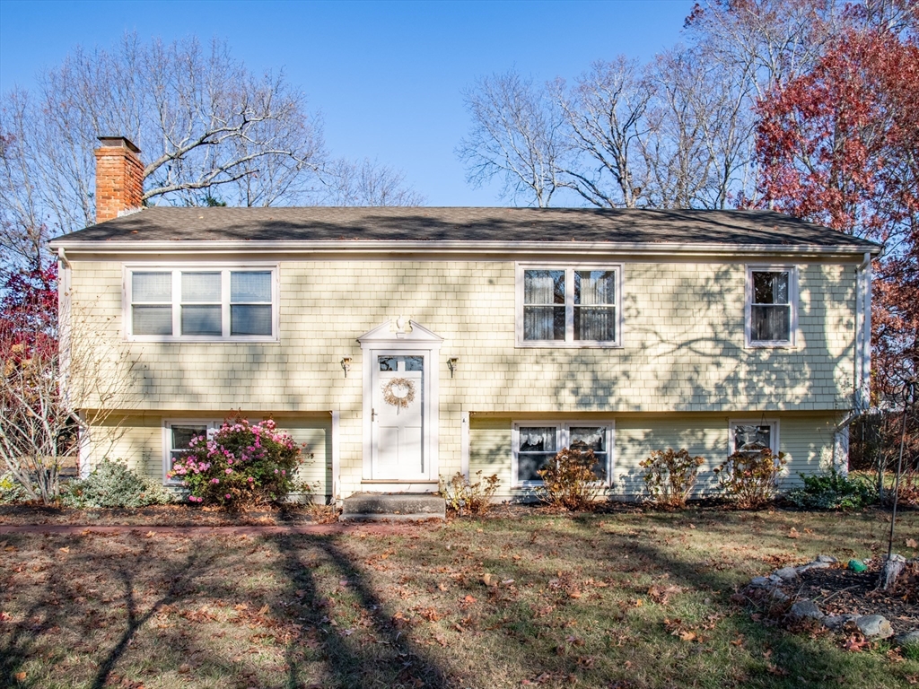 a front view of a house with yard