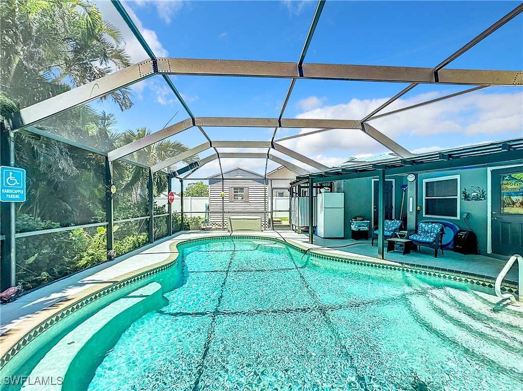 a swimming pool with yard in front of it