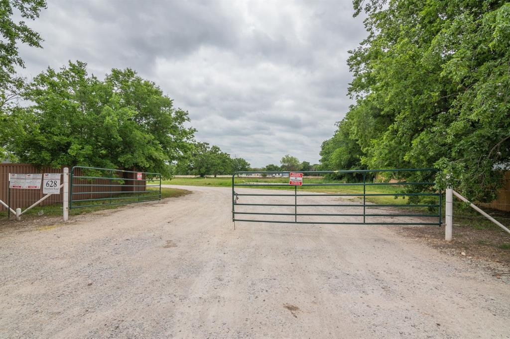 a view of outdoor space with wooden fence