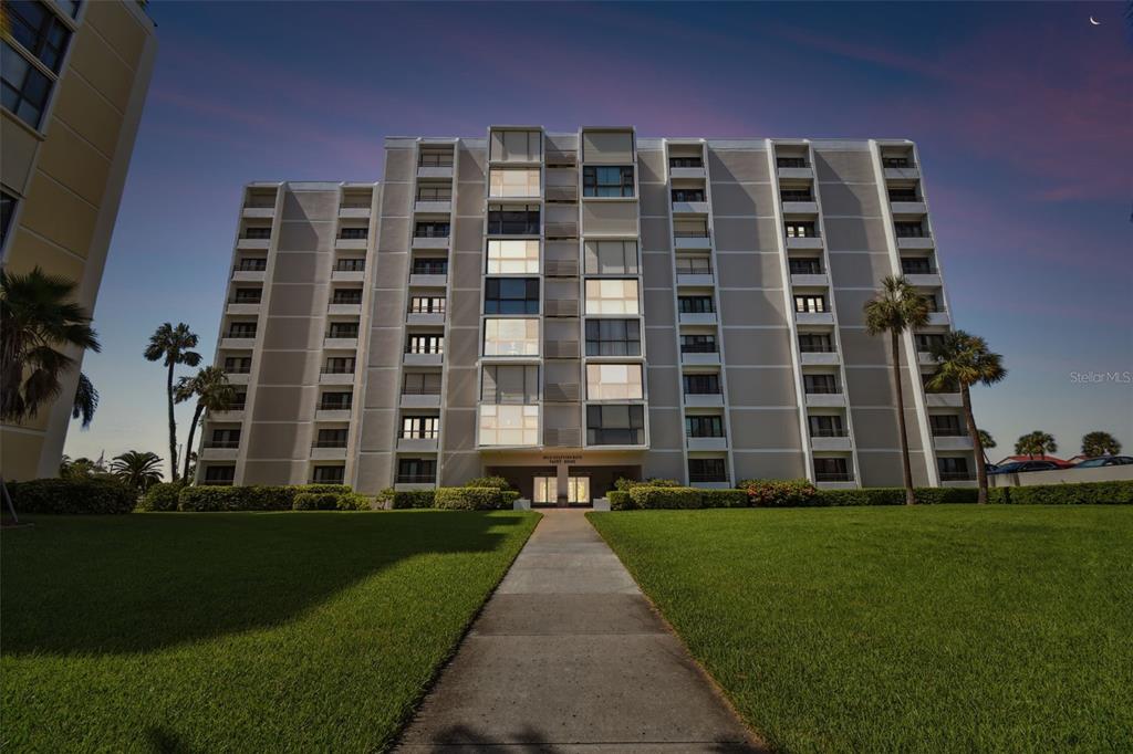 a view of a building with a yard