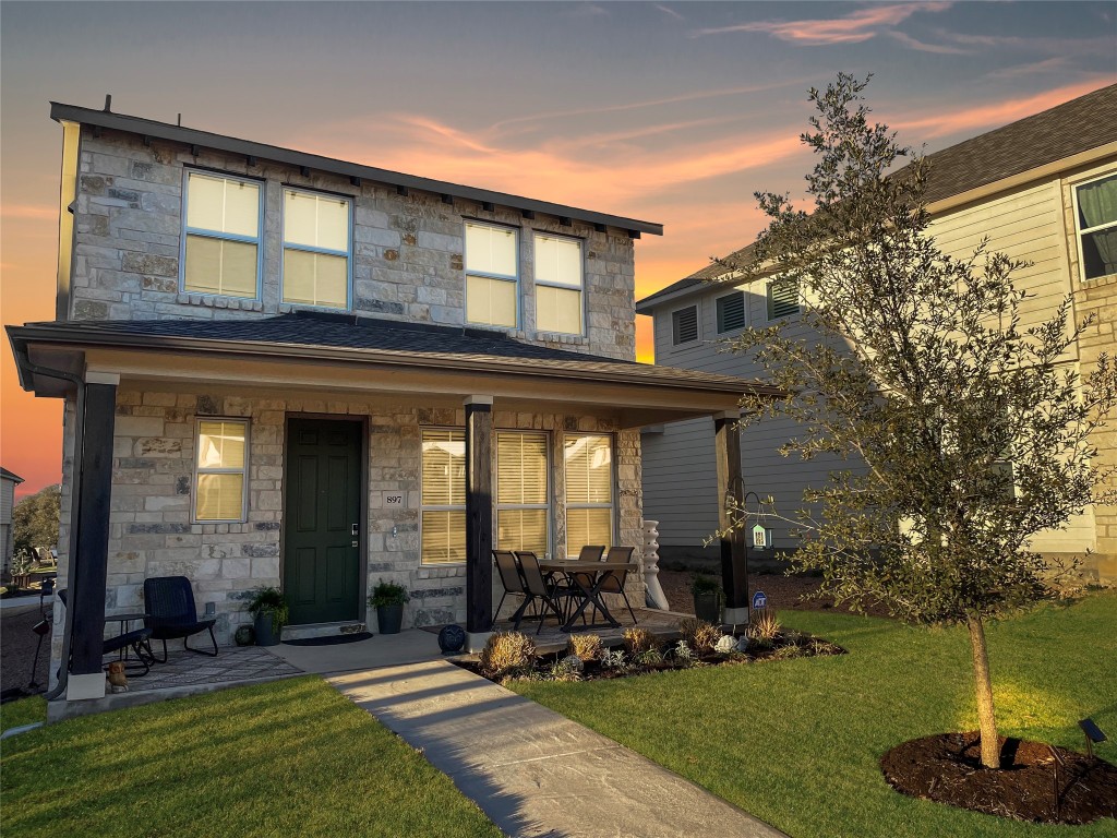 a front view of a house with a yard