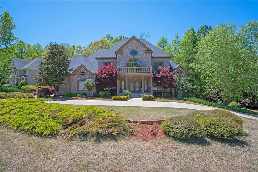 a front view of house with yard and outdoor seating