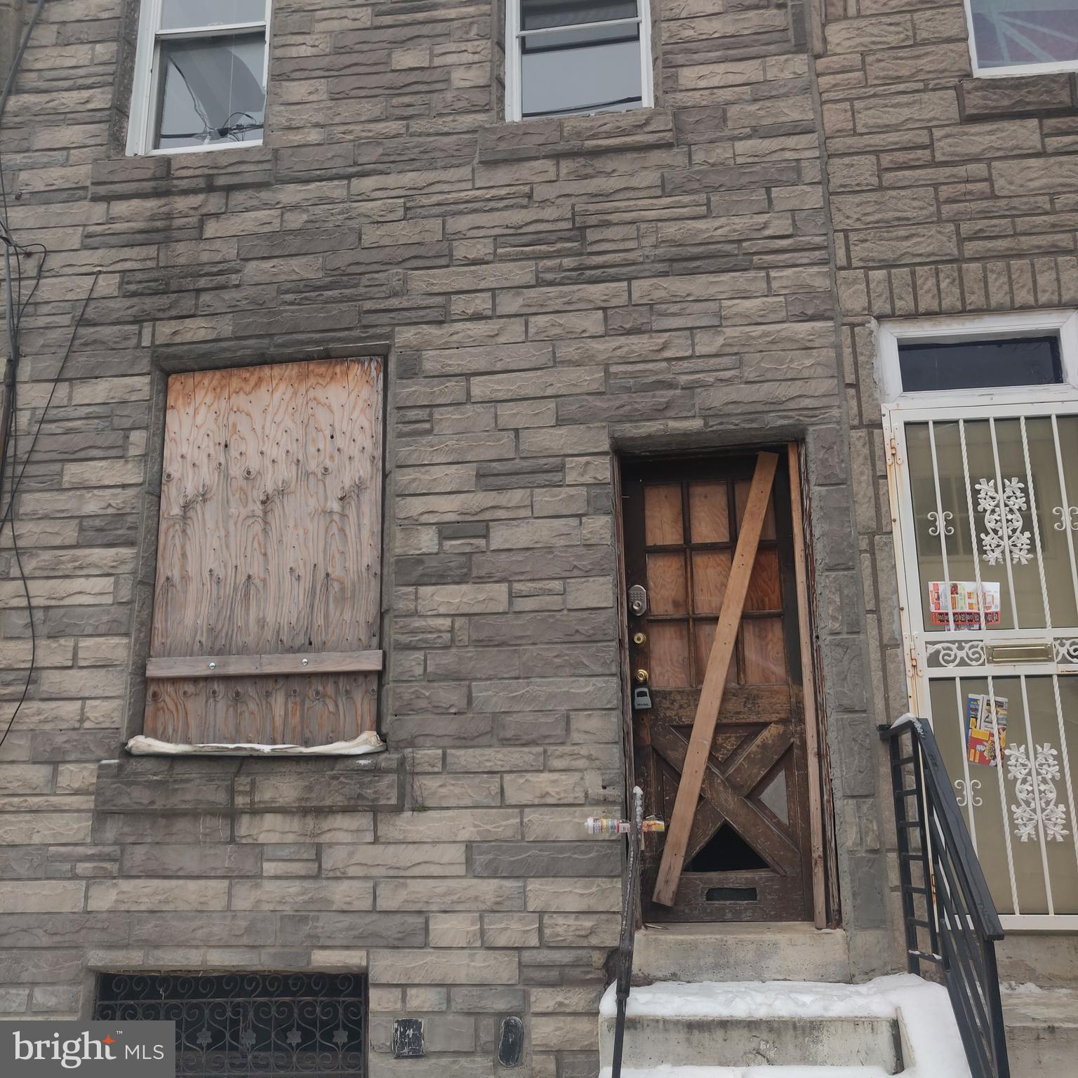 a brick building with a door and a door