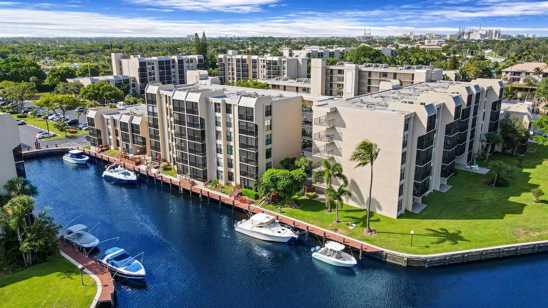 an aerial view of a house with a swimming pool patio and lake view