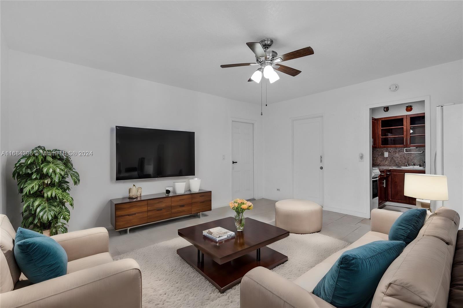 a living room with furniture and a flat screen tv