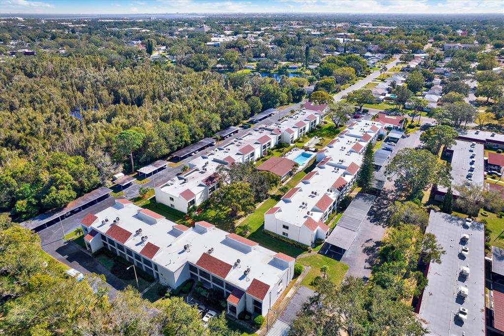 an aerial view of residential houses with outdoor space