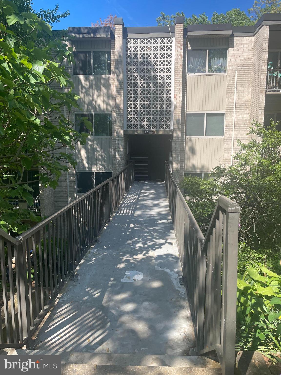 a balcony with view of outdoor space