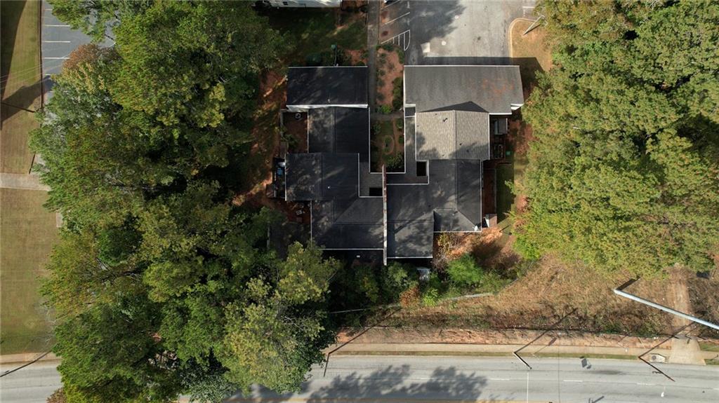 an aerial view of residential houses with outdoor space