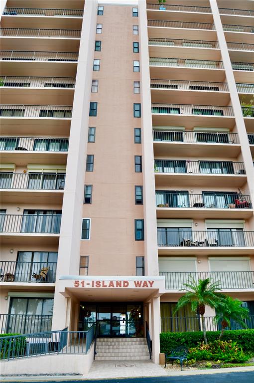 a view of a tall building from a balcony