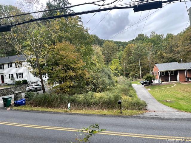 a view of a yard in front view of a house