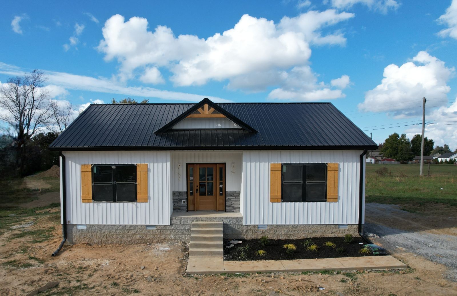 a front view of a house with a yard