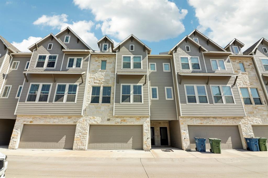 a front view of a house with a garage