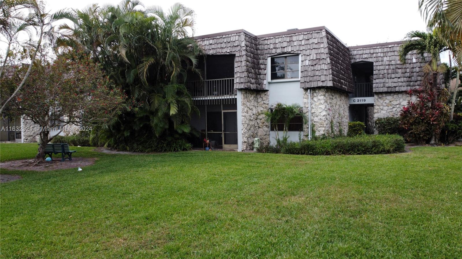 front view of a house with a garden