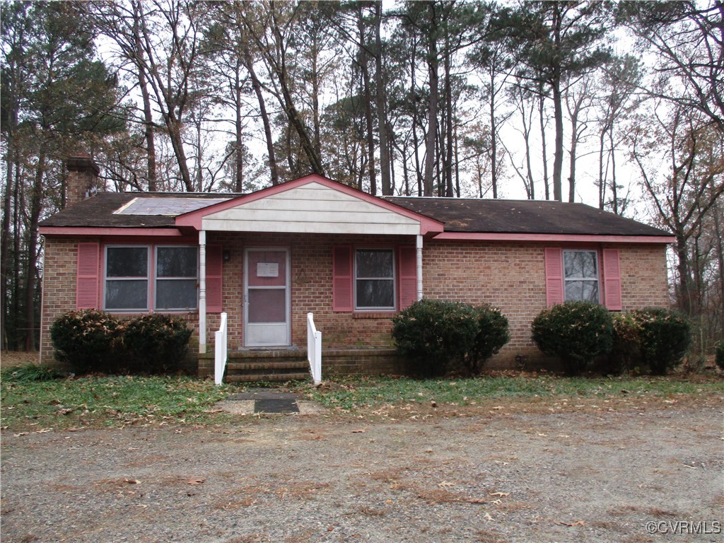 a front view of a house with garden and porch