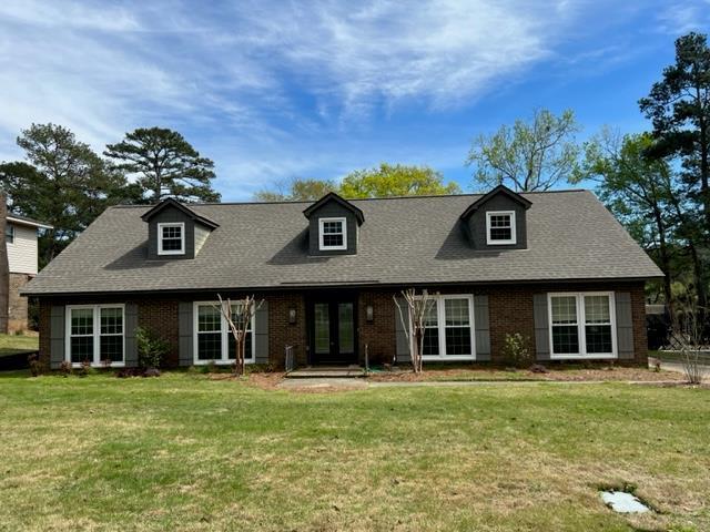 front view of a house with a garden