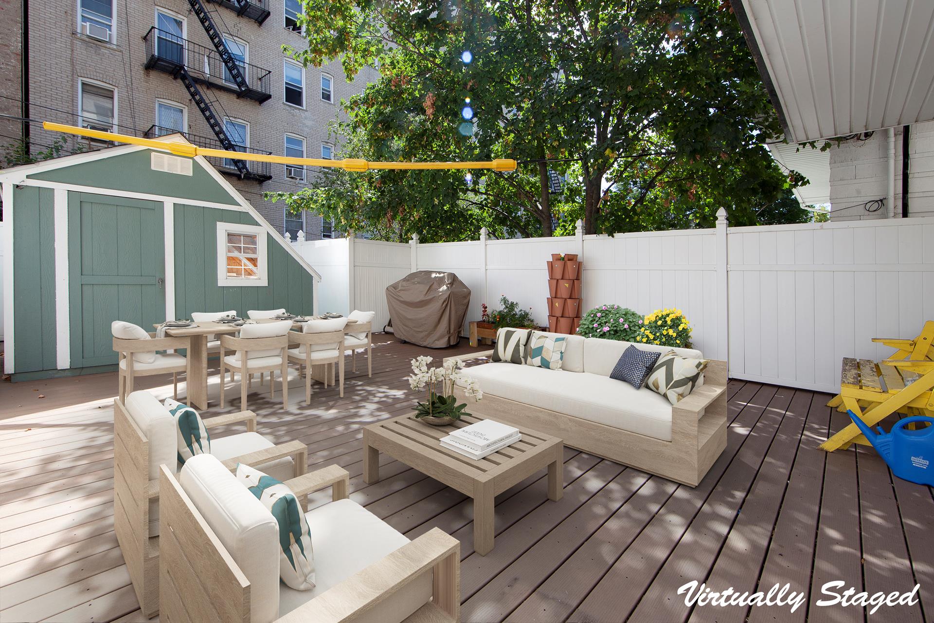 a view of a patio with couches table and chairs and potted plants