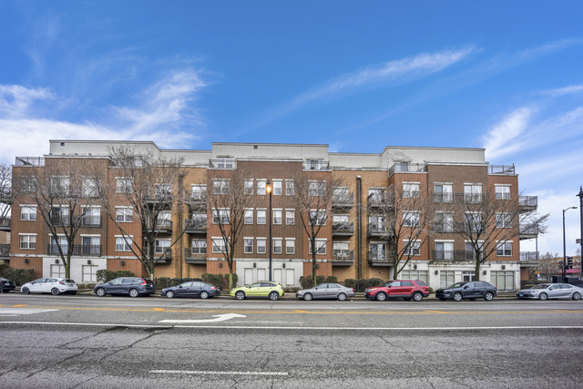 a view of a building with a street