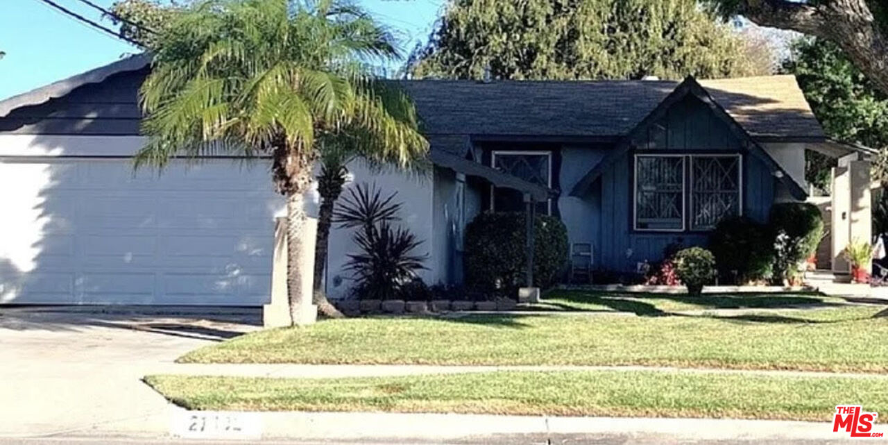 a house with trees in front of it