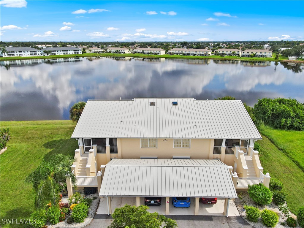 an aerial view of a house with a lake view