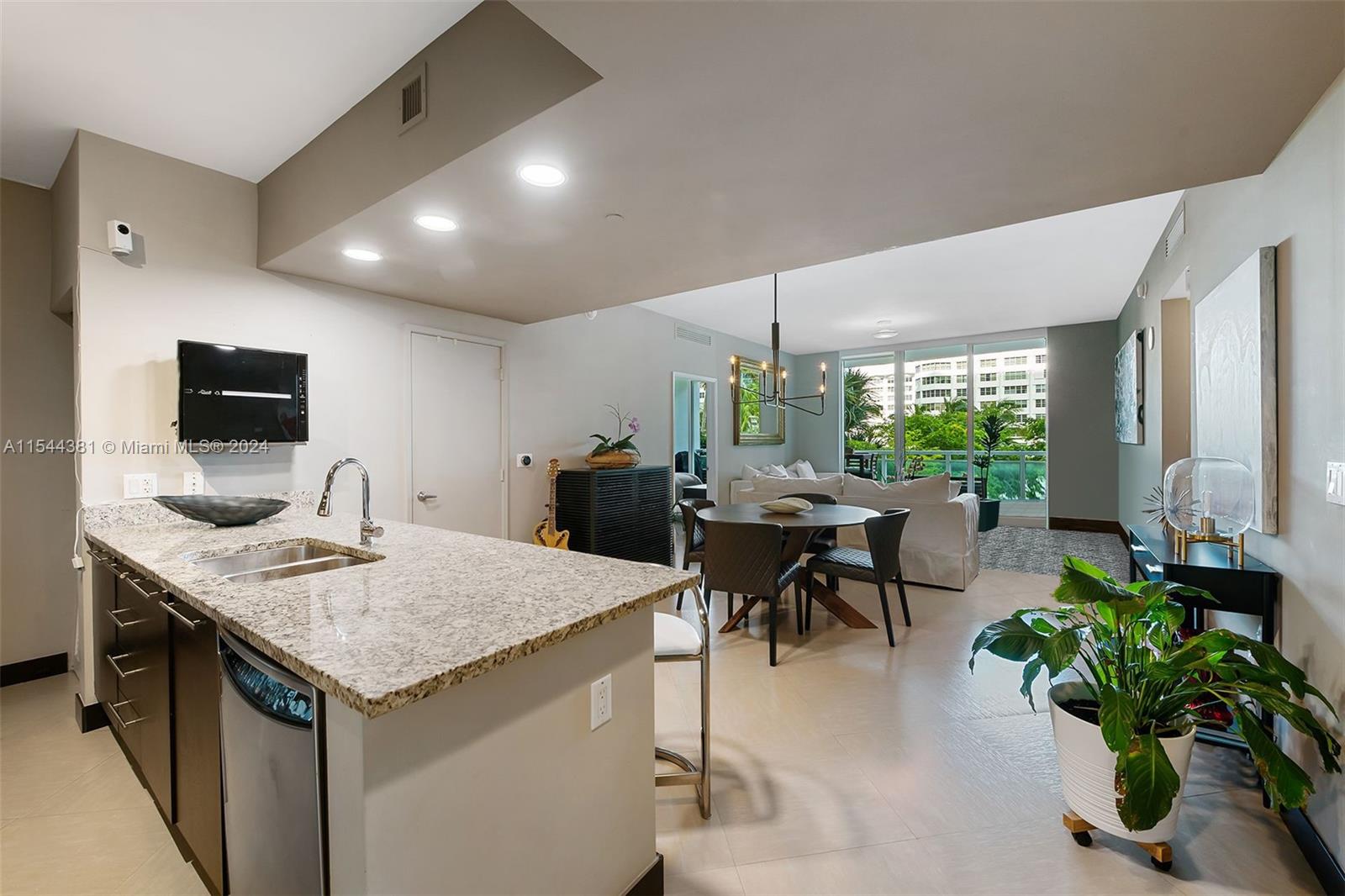 a open kitchen with a table and chairs in it