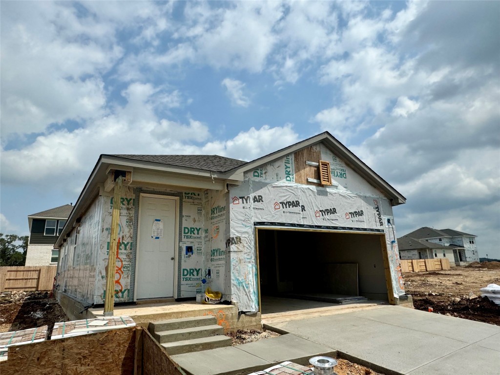 a front view of a house with a garage