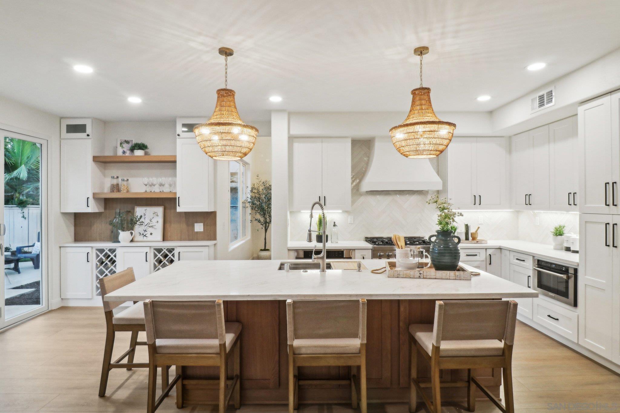 a kitchen with a dining table and chairs