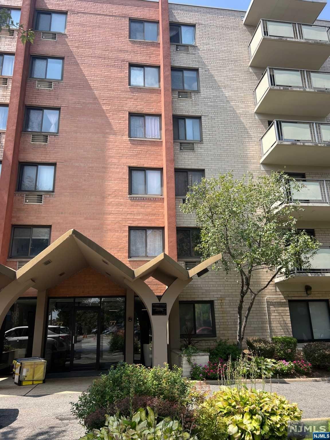 a front view of a building with glass windows