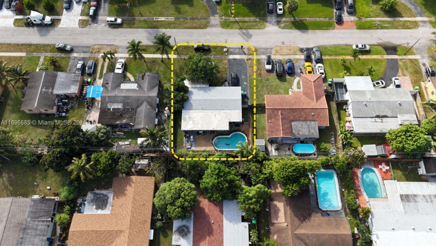 an aerial view of multiple houses with outdoor space