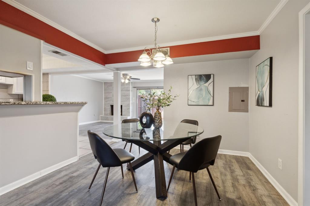 a dining room with furniture and window