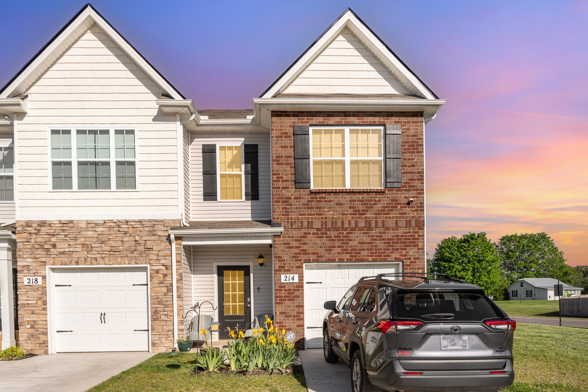 a view of a car parked in front of a house