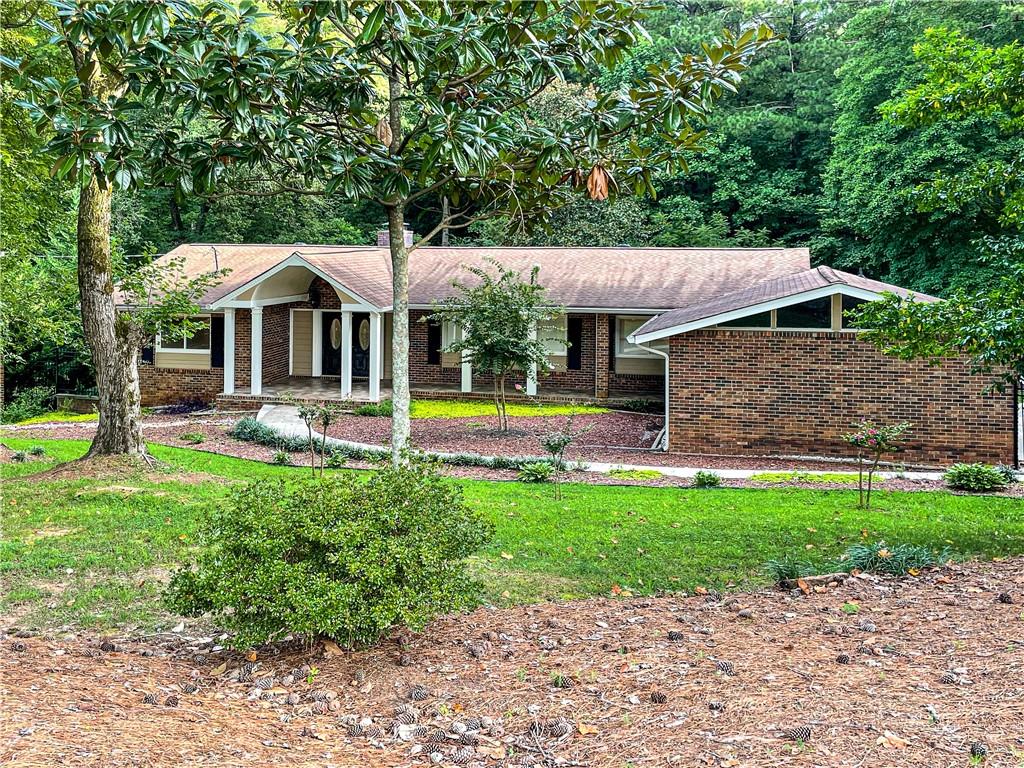 a front view of a house with garden