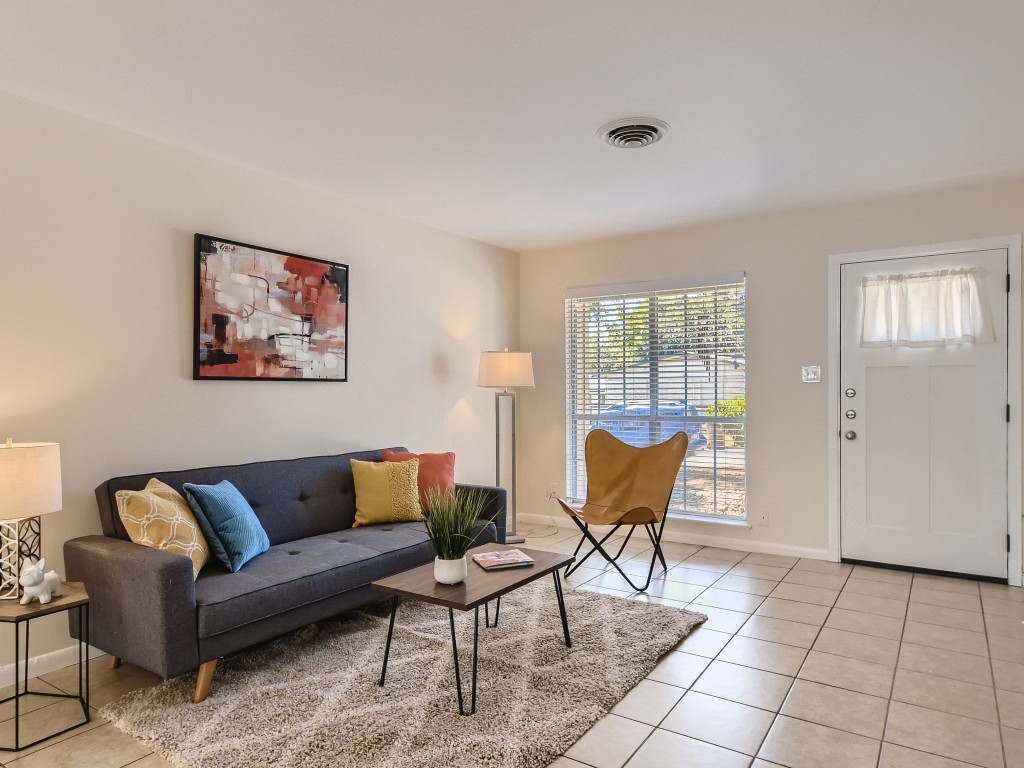 a living room with furniture and a window