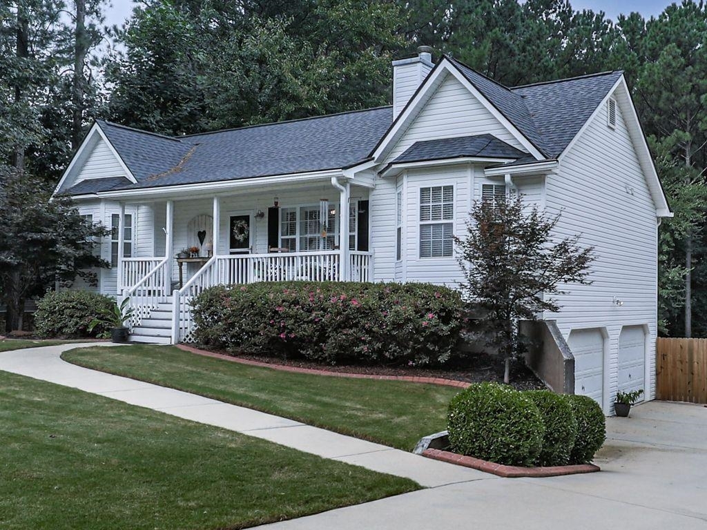 a front view of a house with a yard