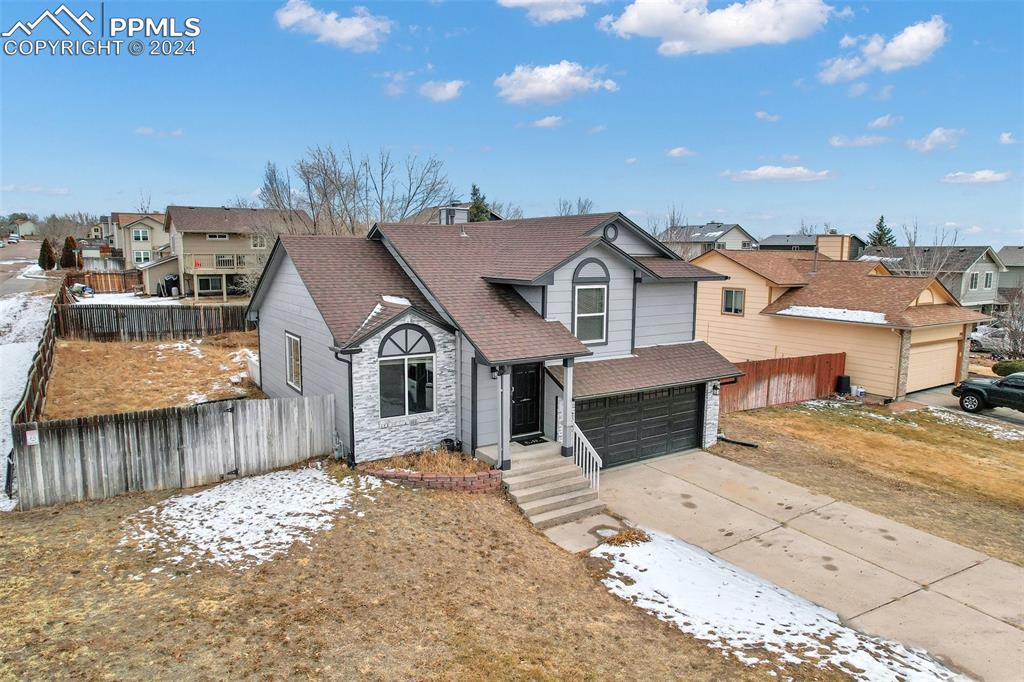 front view of a house with a yard