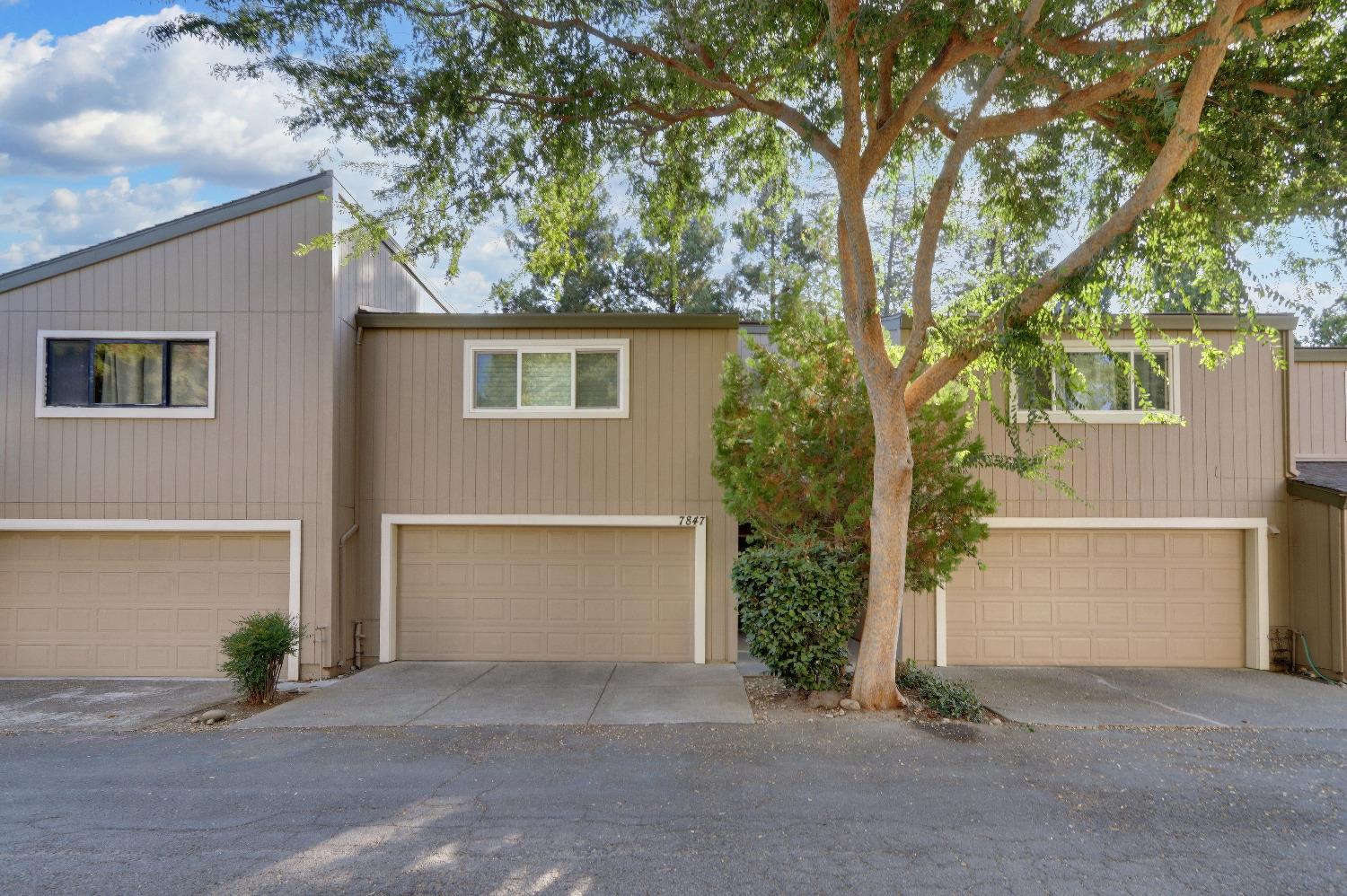 Front of townhome, 2 car connected garage with full laundry. Washer and dryer included.