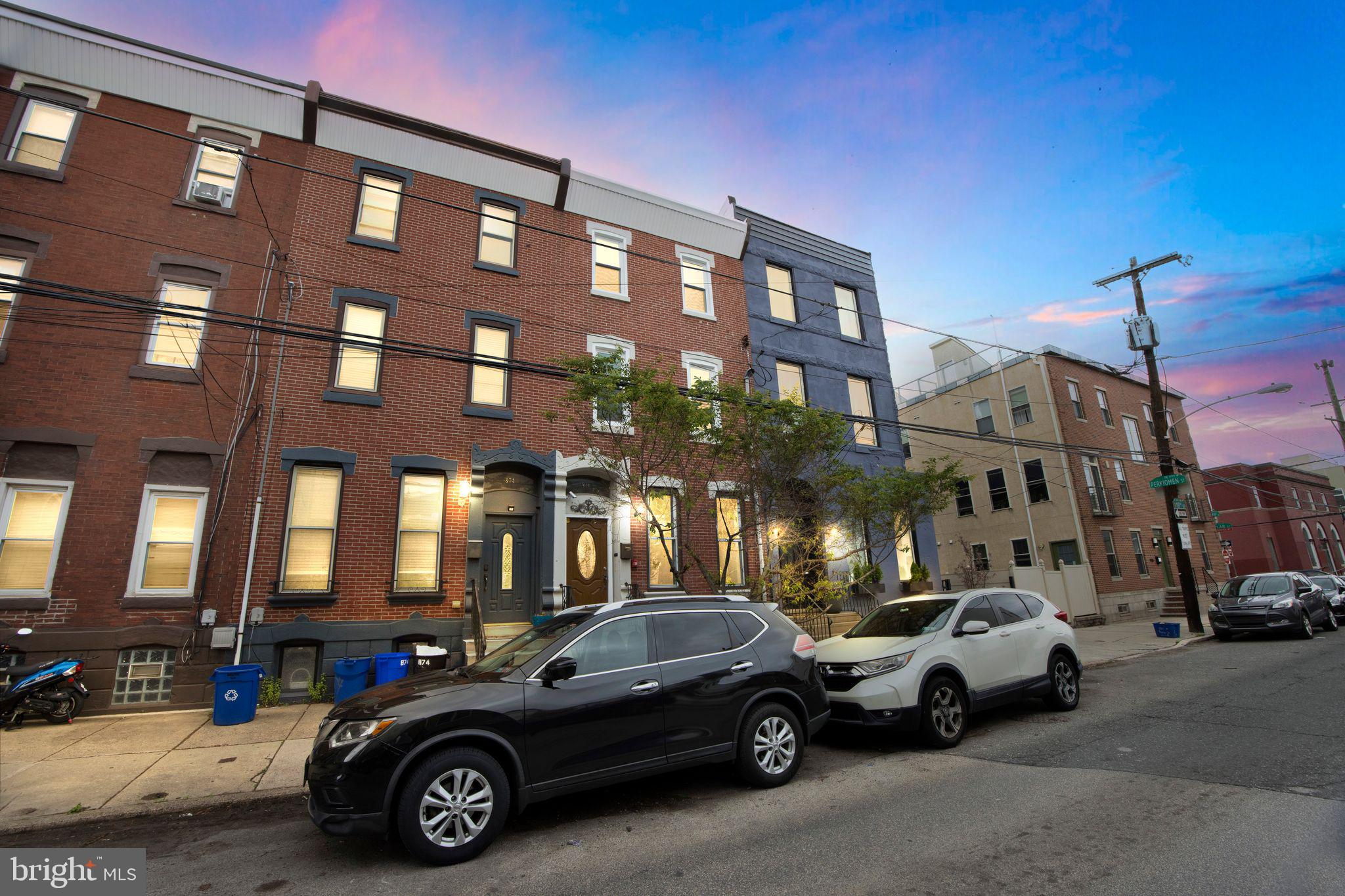 a view of a car parked in front of a building