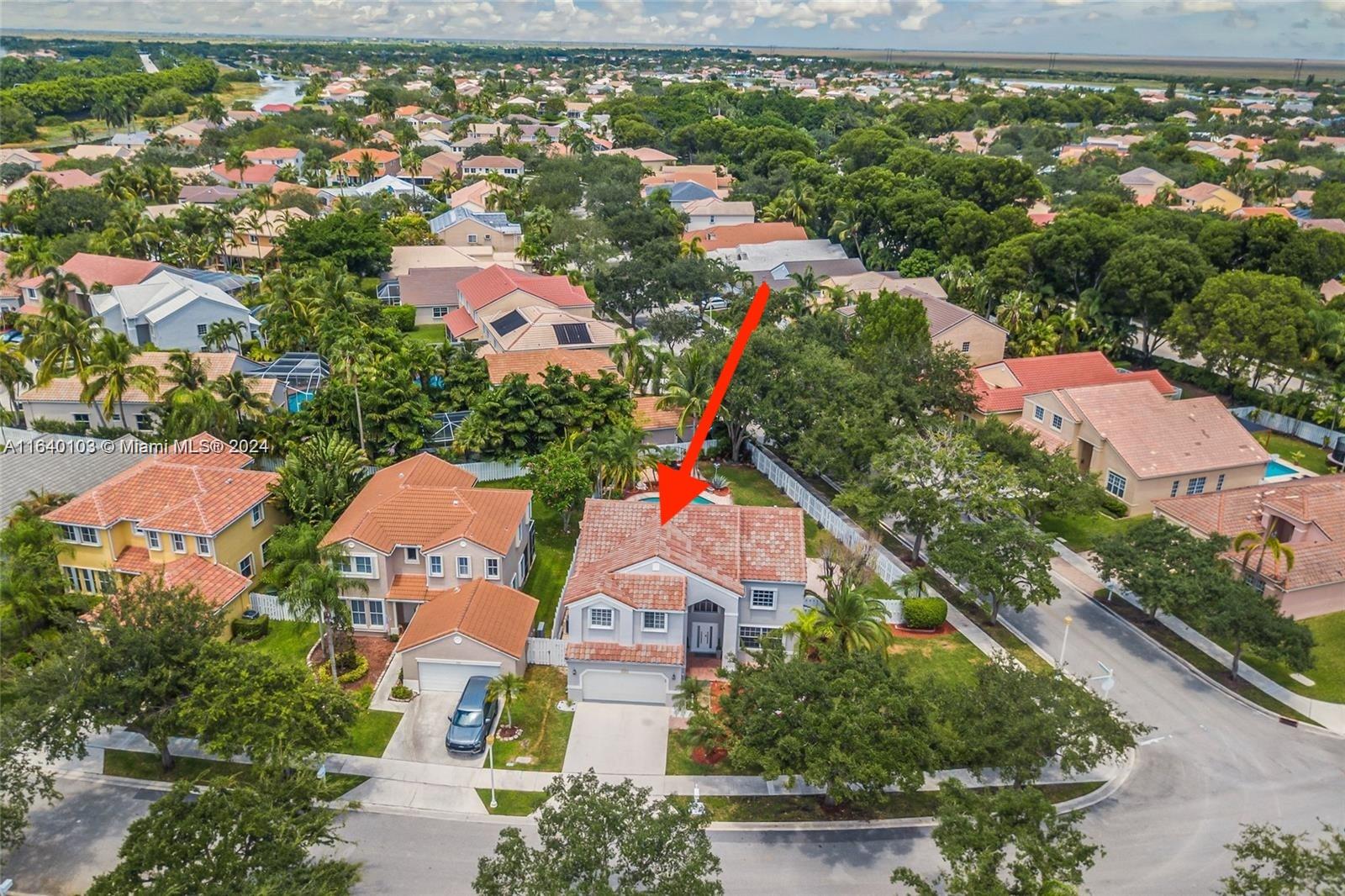 an aerial view of house with yard