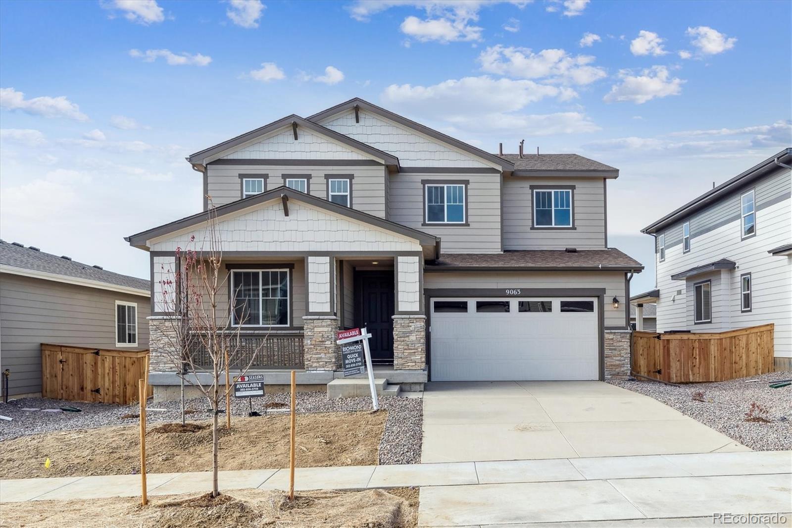 a front view of a house with garage