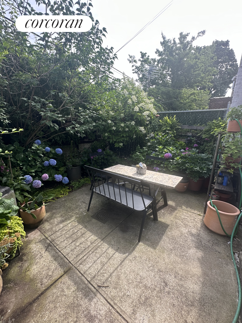 a view of a backyard with sitting area and outdoor seating