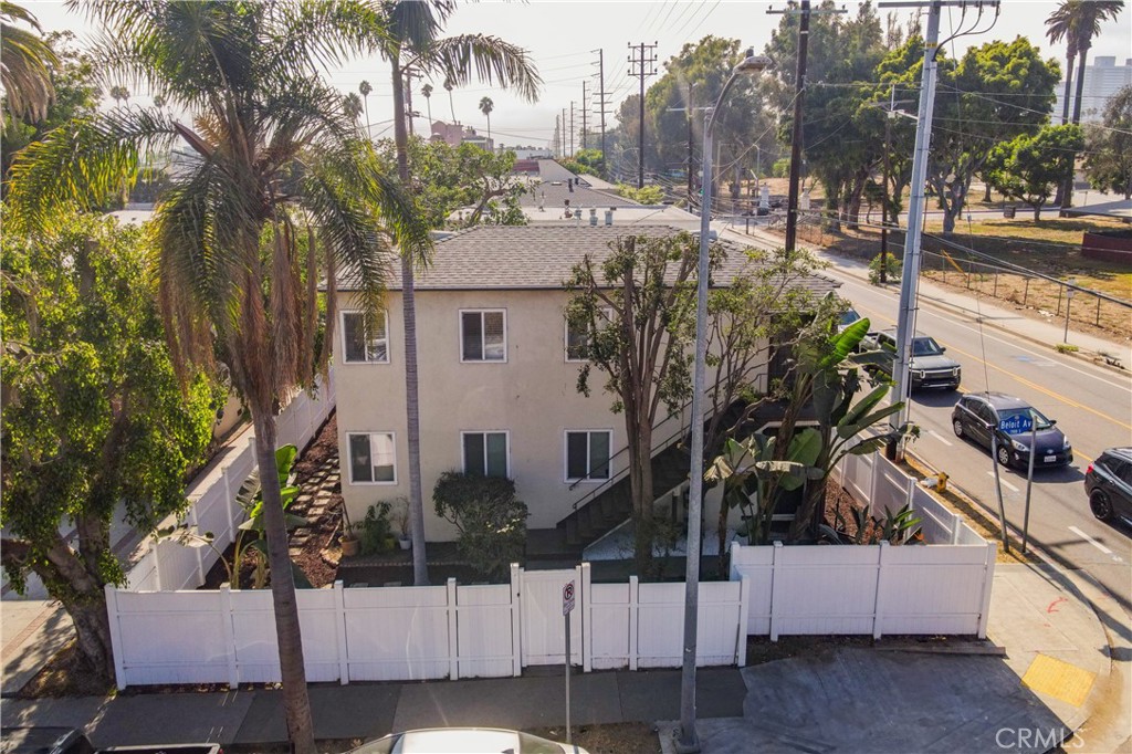 a view of a house with a tree in the background