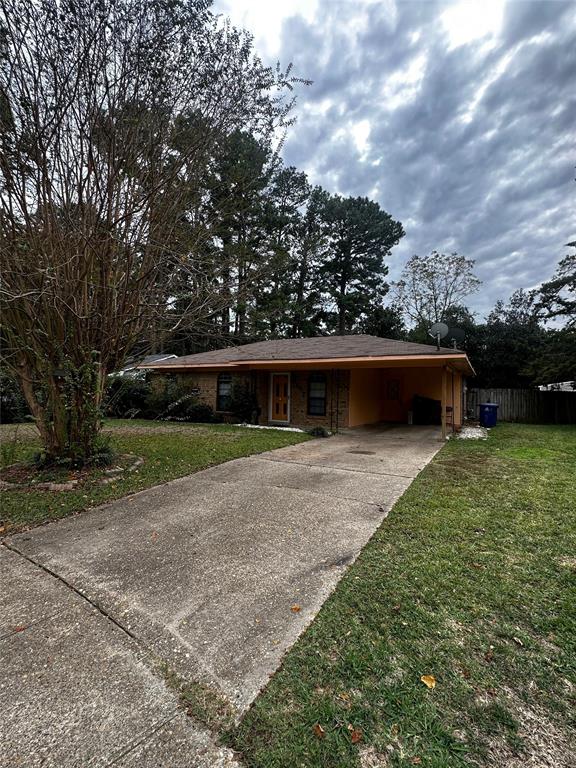 a front view of a house with a yard and a garage