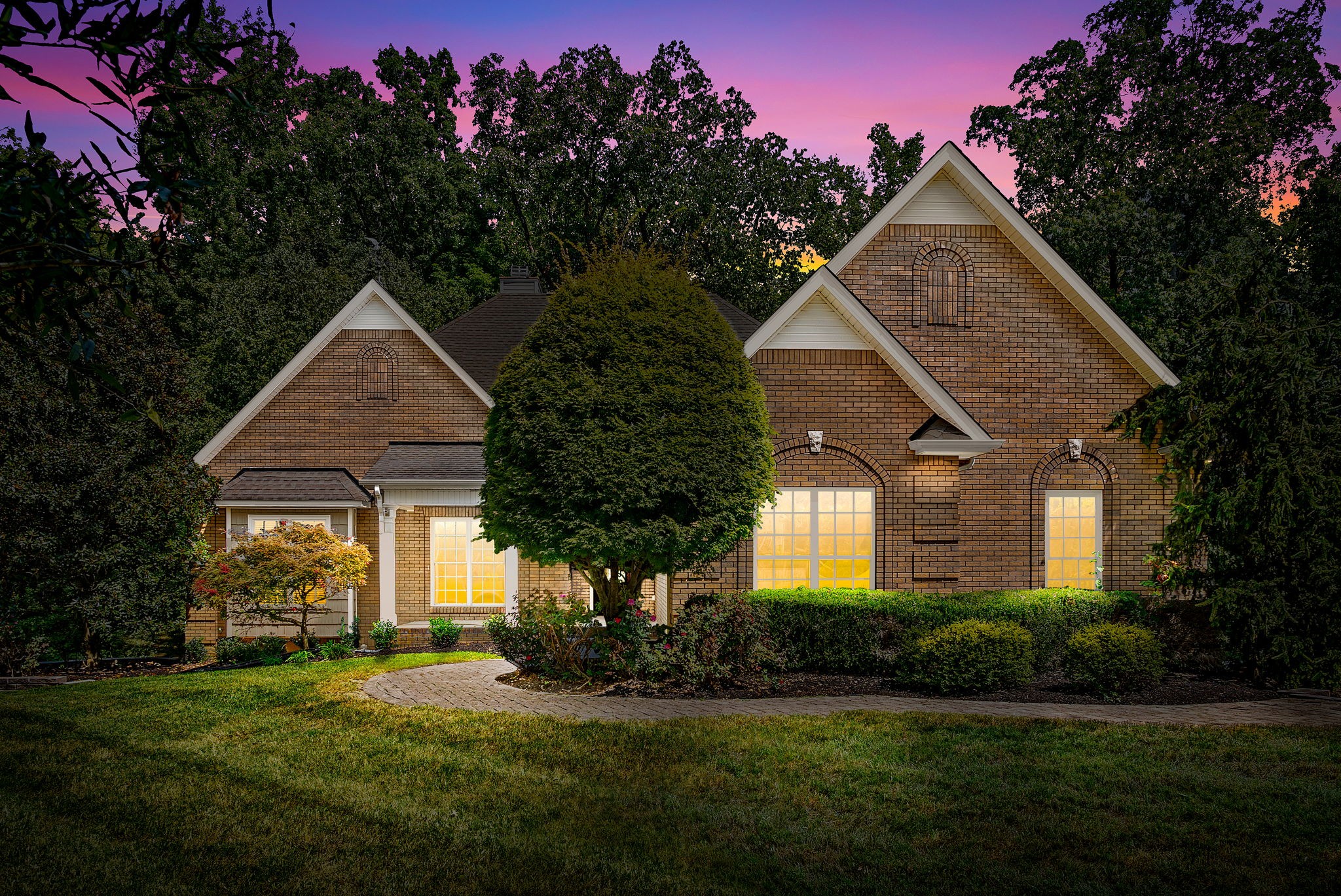 a front view of a house with a yard