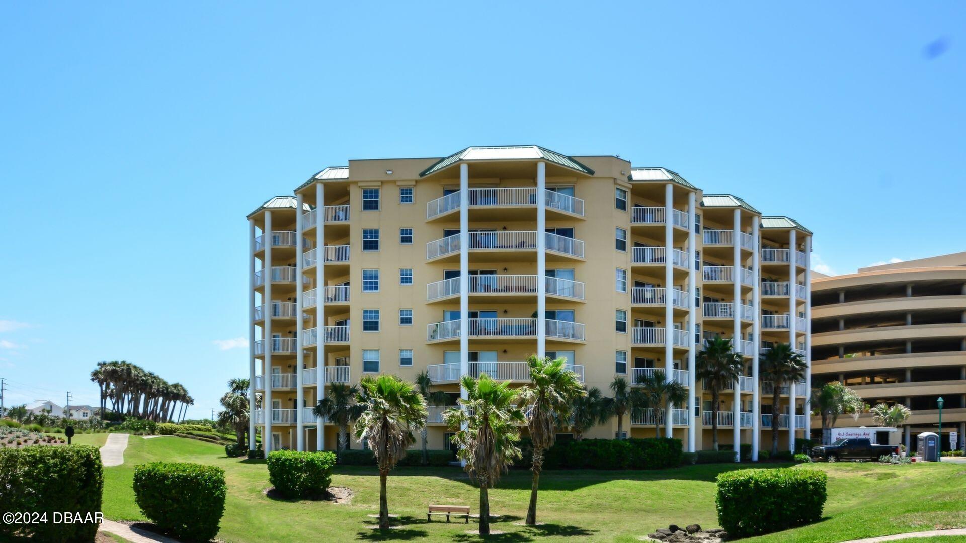 a view of a building with a garden