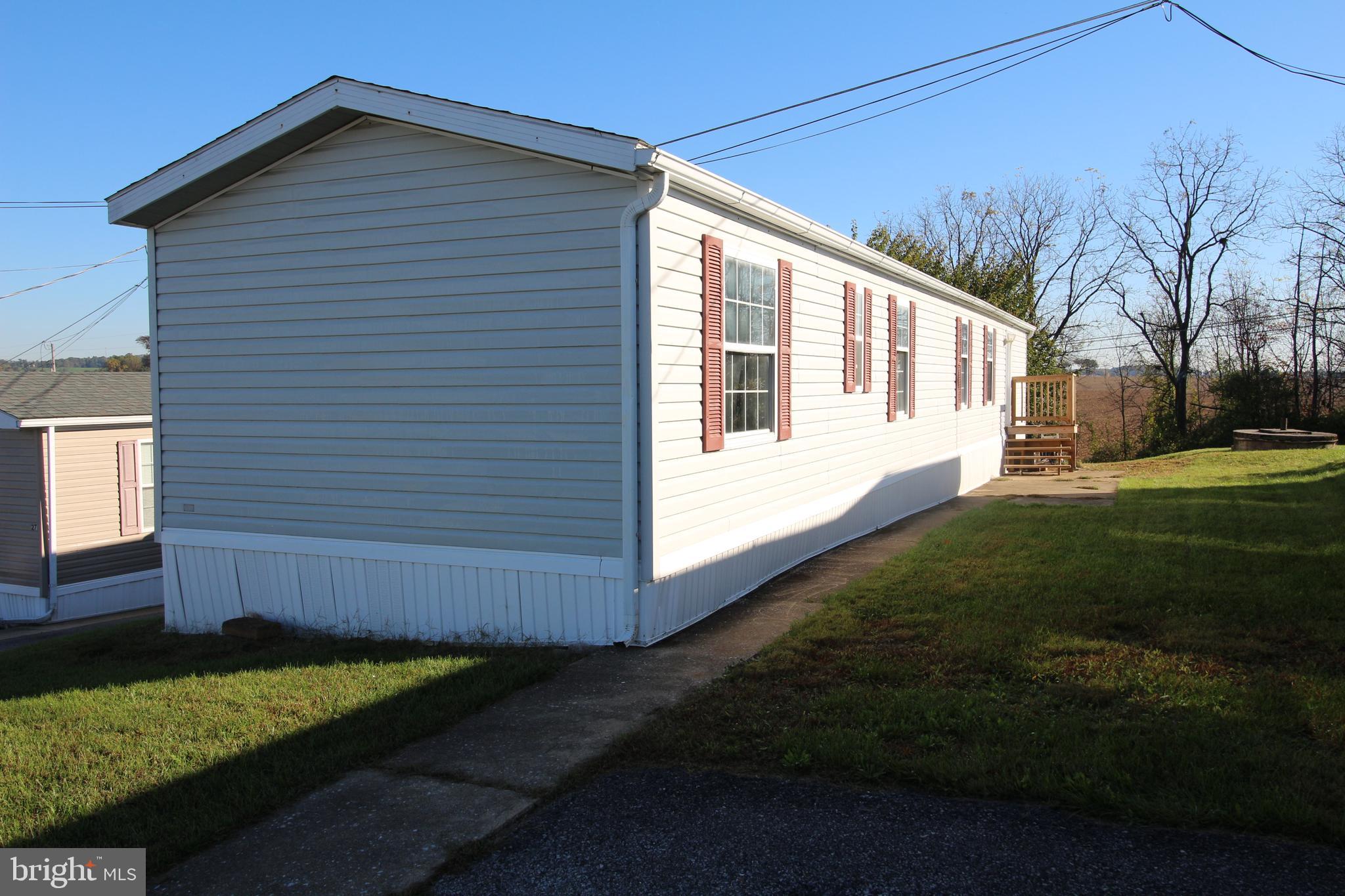 a view of house with backyard