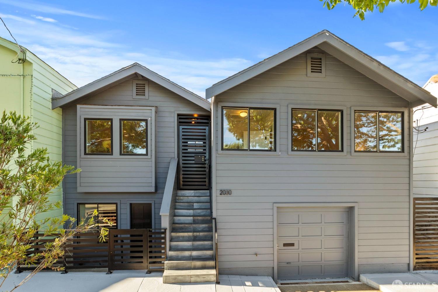 a front view of a house with garage